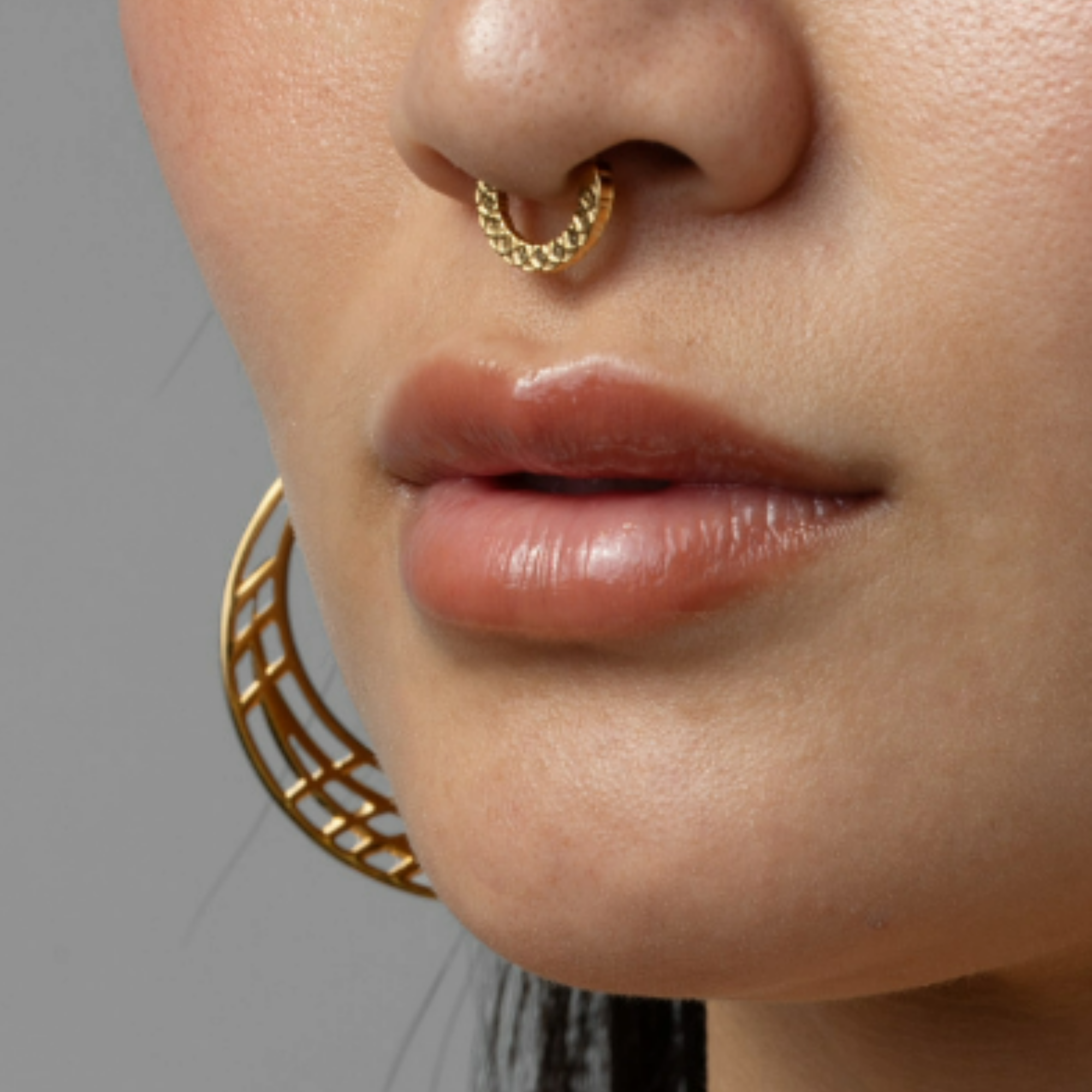 Minimal stainless steel clicker ring with a secure hinged closure.
